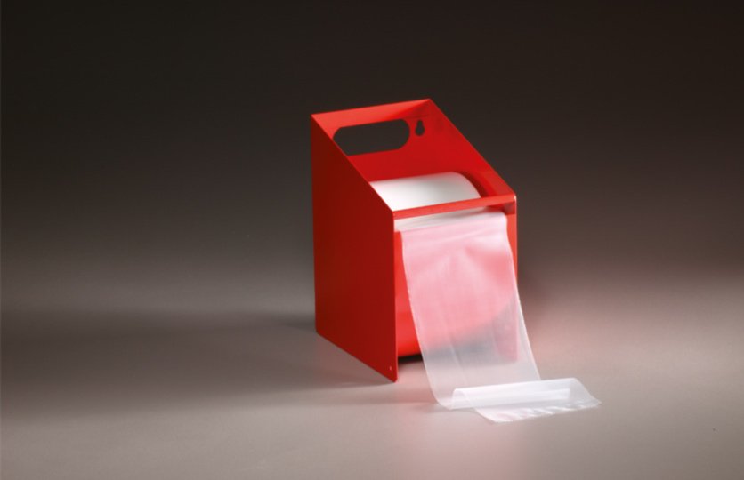 Sanstrap® Dehnbänder in robuster Metallbox zur sicheren Aufbewahrung und schnellen Entnahme am Arbeitsplatz.