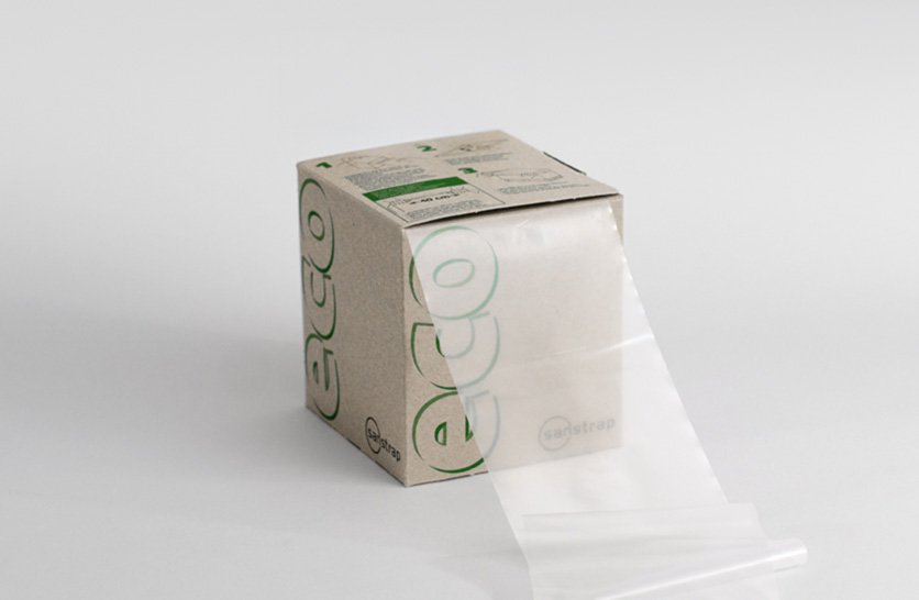 Sanstrap® eco Dehnband-Box mit transparentem Recyclingband zur umweltschonenden Palettensicherung.